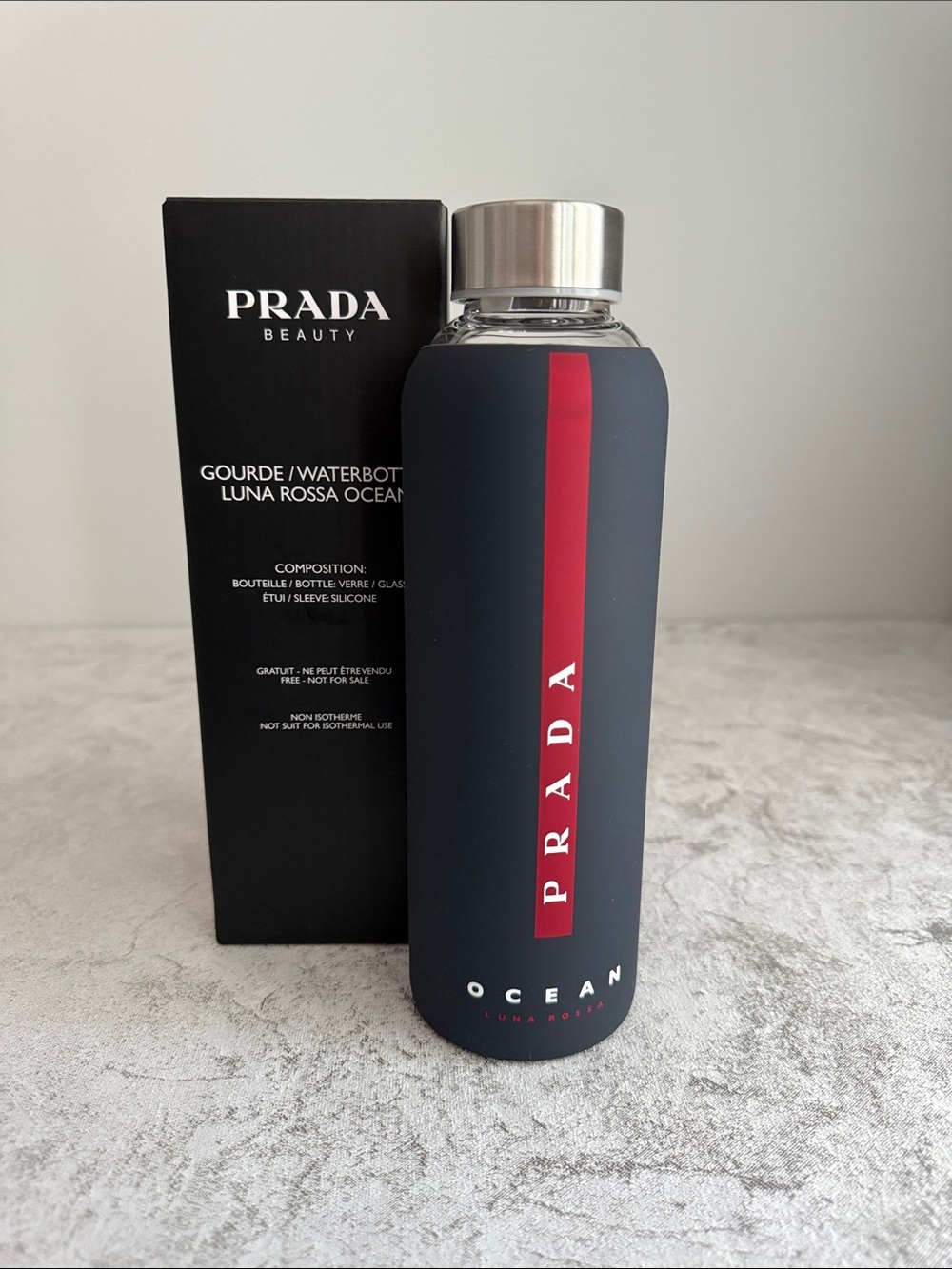 Prada Navy Bottle with Red Vertical Stripe